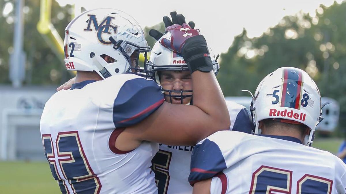 Mallard Creek’s Casey Kelly (center) scores his first touchdown for the Mavericks. Mallard Creek beat Butler 36-28 Friday in Matthews.