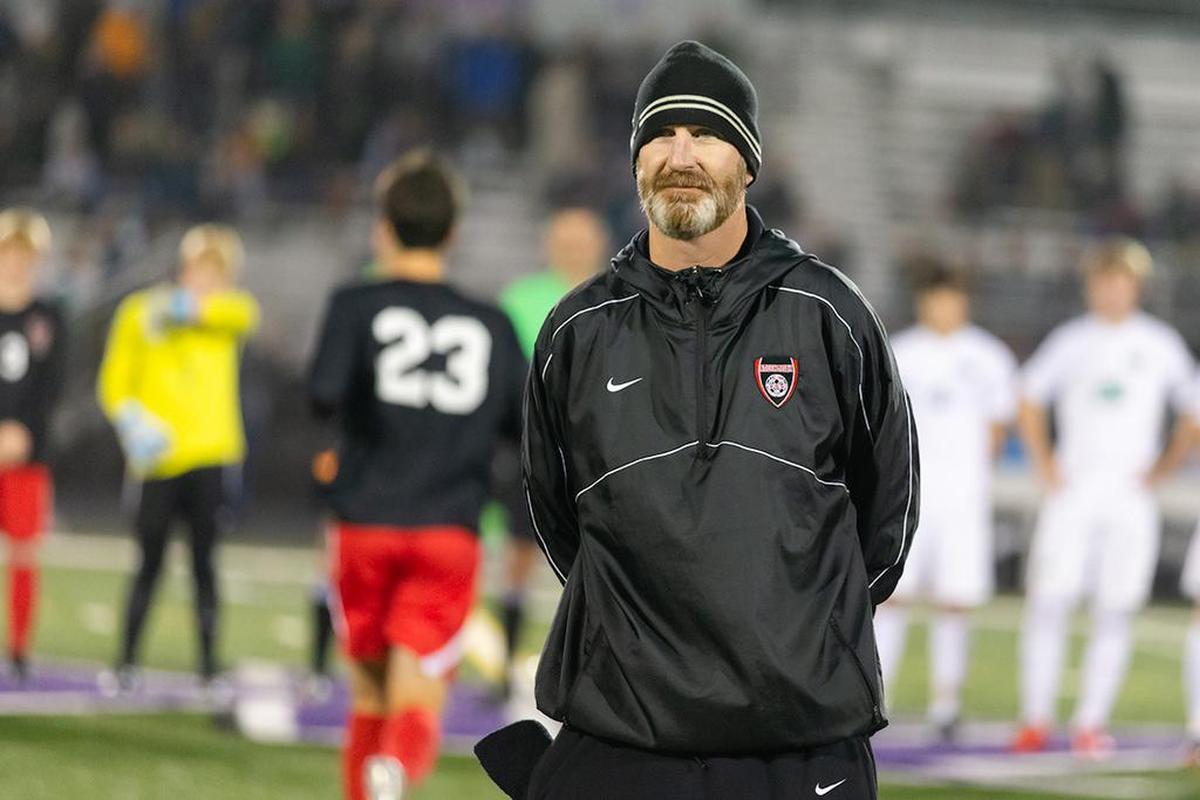South Meck head coach Eric White looks on as his team prepares for their semifinal match against Myers Park.