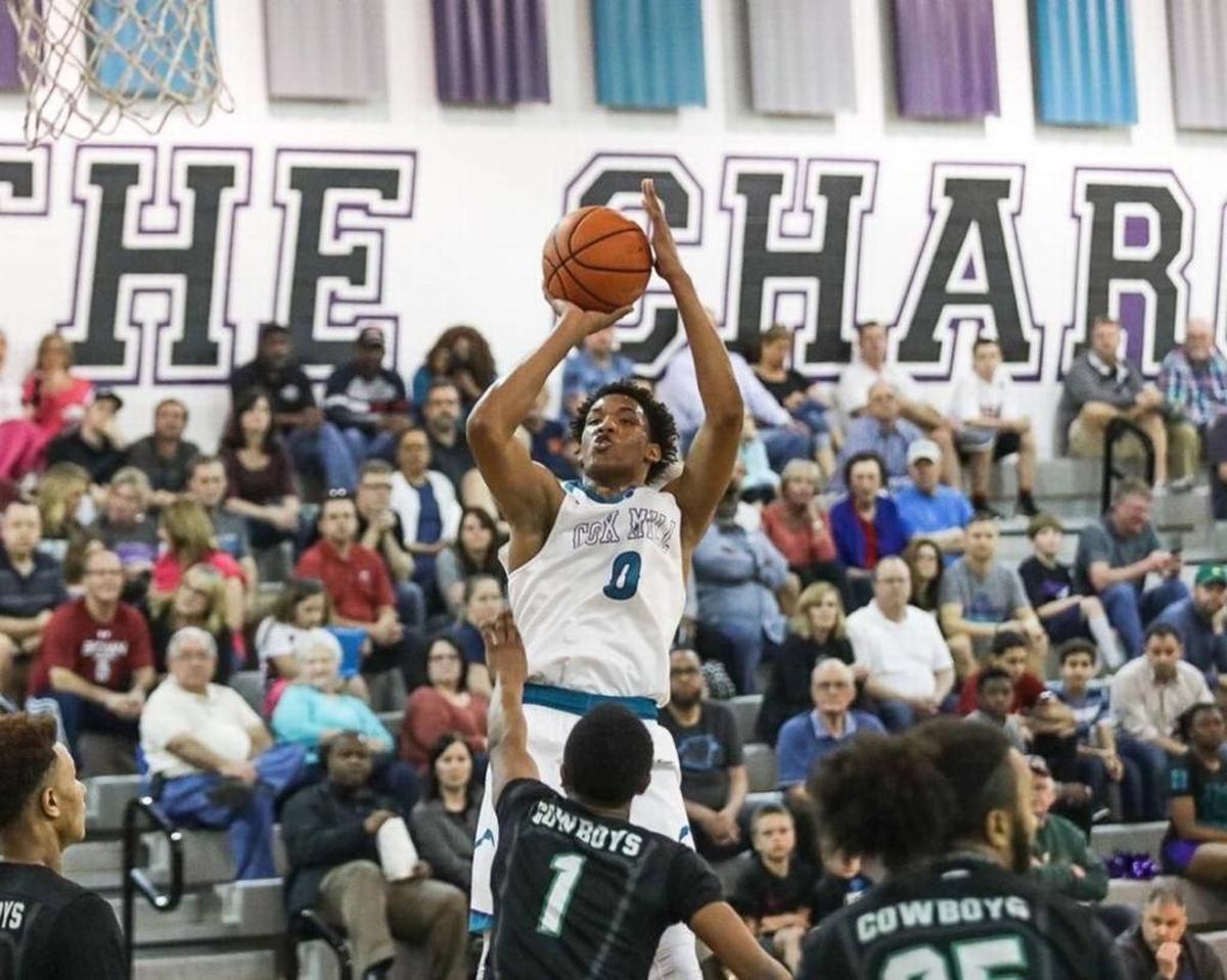 Cox Mill junior Wendell Moore attempts a jump shot in a recent game.