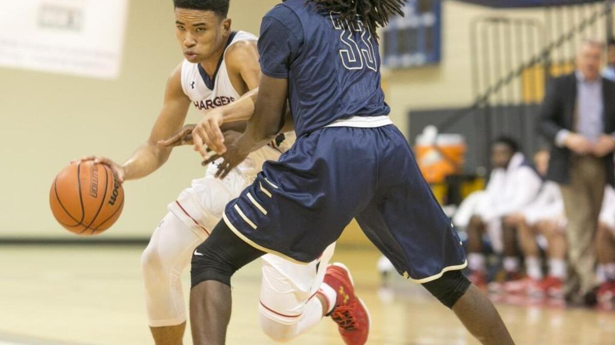 Providence Day's Devon Dotson, left, tries to get around Douglas County High's Raphael Rogers during a Hoodie's House National High School Hoop's Classic prep basketball game Monday, December 28, 2015 held at Providence Day School. JASON E. MICZEK - Special to the Observer