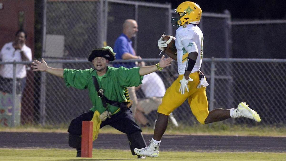 Richmond's Damontre Bennett (6) reaches the end zone as school mascot welcomes him, against Butler for a touchdown in the second quarter at Butler High on Friday, September 9, 2016.