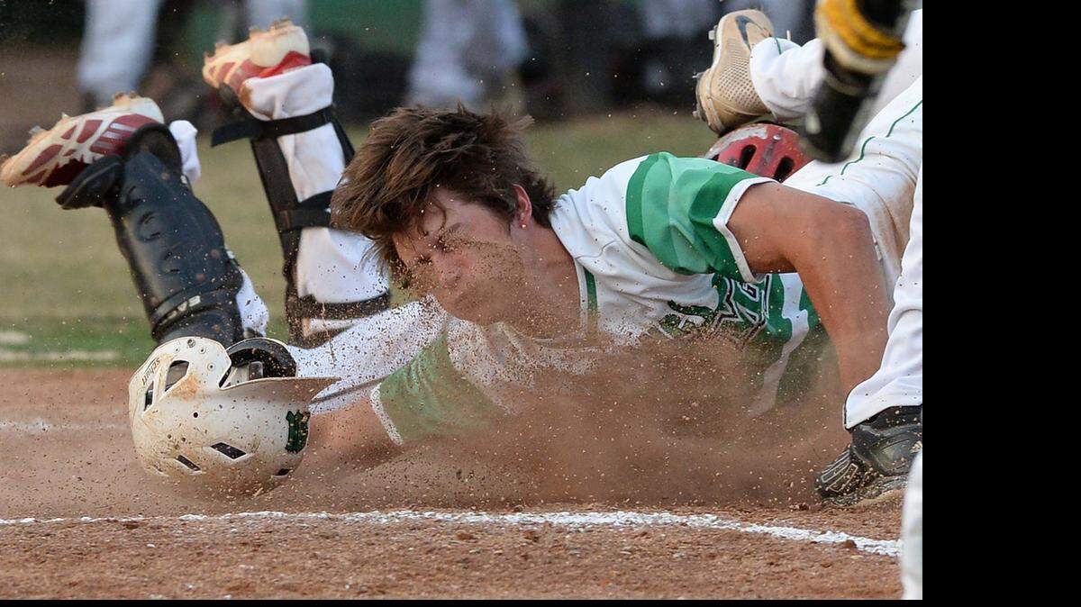 
Myers Park runner Davis Ray gets thrown out at home plate during Friday night's second round NC 4A playoff game played at Myers Park High May 15,2915.
