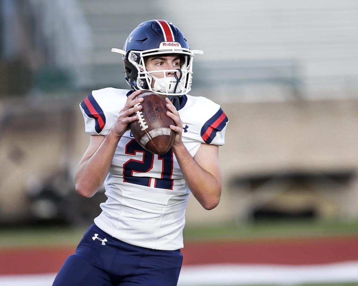 Providence Days’ Dillon Carter (21) warms up before his team’s 42-6 win at Charlotte Country Day.