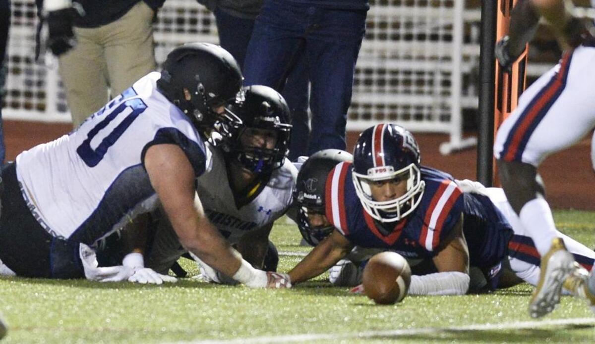 Providence Day and Charlotte Christian players scramble for a fumble during the first half of their game on Friday, October 27, 2017. Charlotte Christian scored 35 points in the second half to win 52-14.