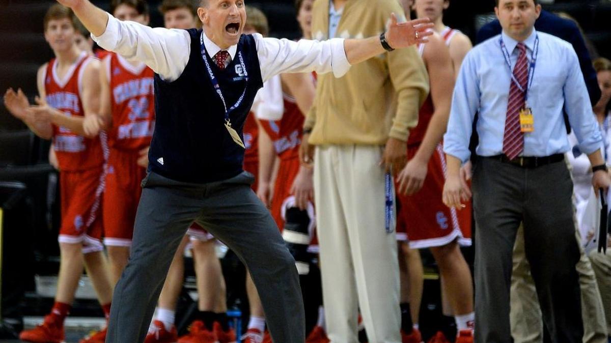 Charlotte Catholic head coach Mike King questions a call during second half action vs North Meck. Charlotte Catholic defeated North Meck 46-41 to win the NC 4A Western Regional championship game at Lawrence Joel Coliseum in Winston-Salem, NC on Saturday, March 5, 2016.