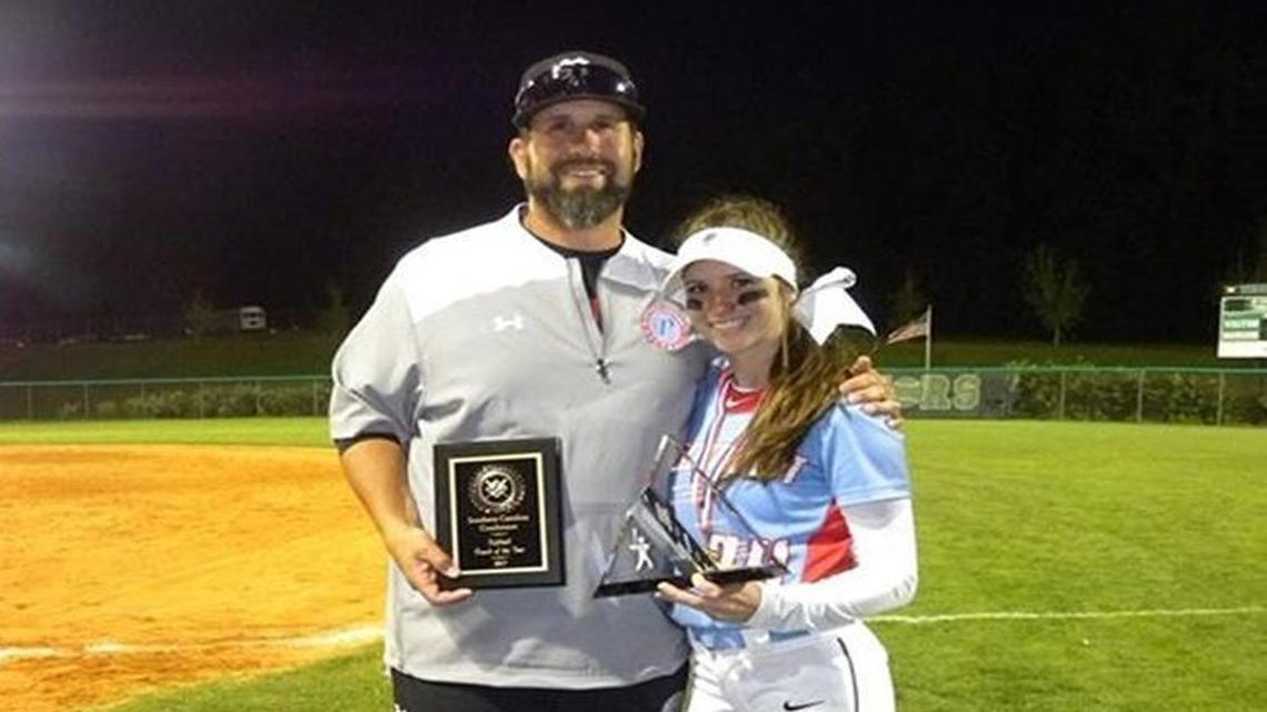Piedmont High softball coach Jason Phelix shares a moment with daughter Kyrah, the team’s senior all-state outfielder.