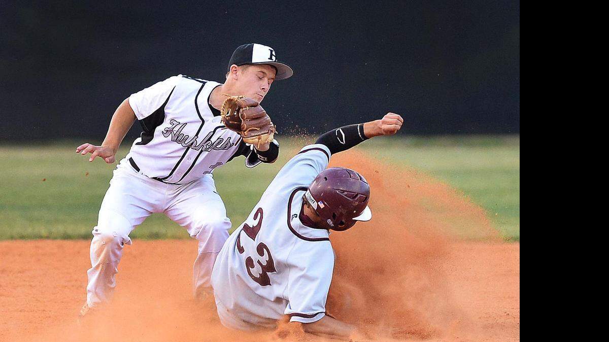 
 J.M Robinson's runner Michael Young,on right, makes it safe to second base after stealing first base, Hough High's short stop Brooks Carroll, on left, makes the tag too late,during Thursday's MECKA 8 baseball championship played at Hopewell High School May 07,2015.
