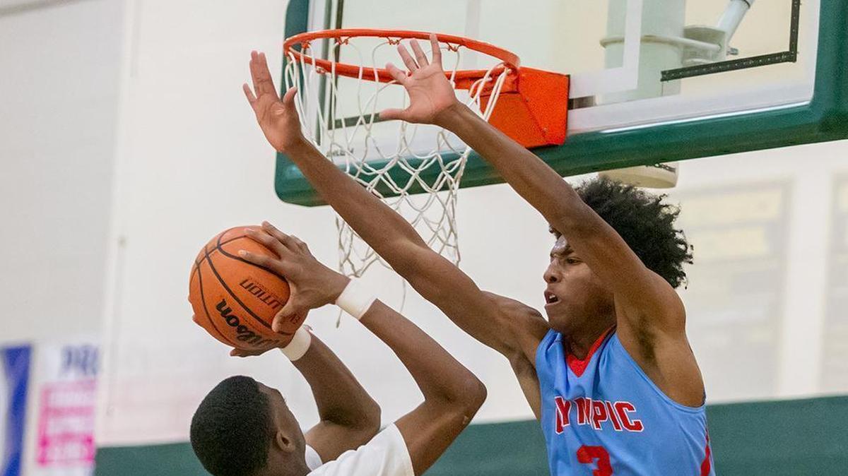Olympic’s Josh Banks (3) gets the block during late 2nd quarter action.