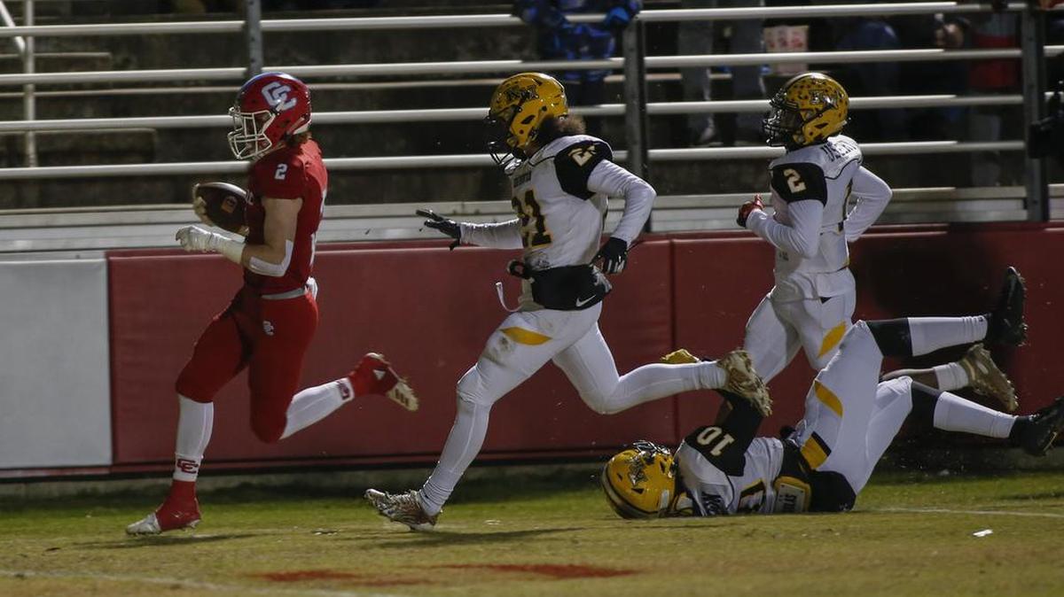 Charlotte Catholic’s Michael Neel (left) and the Cougars hope to repeat as N.C. 3A state champs Saturday
