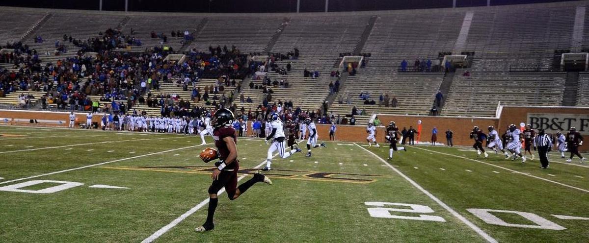 Harding quarterback Braheam Murphy runs down the field for a 95-yard touchdown against Scotland County during fourth-quarter action in the NCHSAA 4A State Championship game at BB&T Field in Winston-Salem on Saturday, Dec. 9, 2017. Harding defeated Scotland County 30-22.