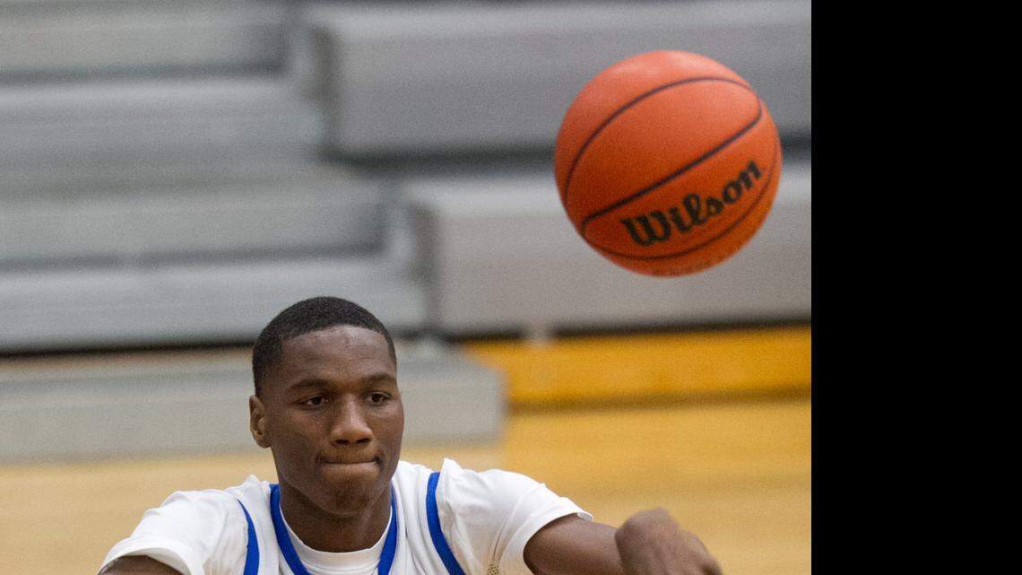 
Victory Christian's Ebuka Izundu passes the basketball while facing Lake Norman at the Hoodies House of Hope Hoops Classic at Ardrey Kell High School in Charlotte,  Dec. 30, 2014. 
