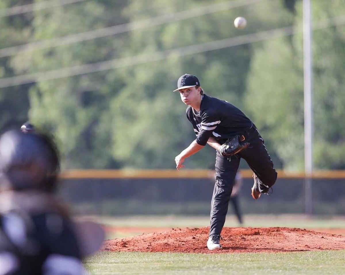 Hough starting pitcher JD Brock (4) warms up for his first inning. Hough would face the number 1 seed Lake Norman Wildcats in the 4A I-Meck Tournament Championship.