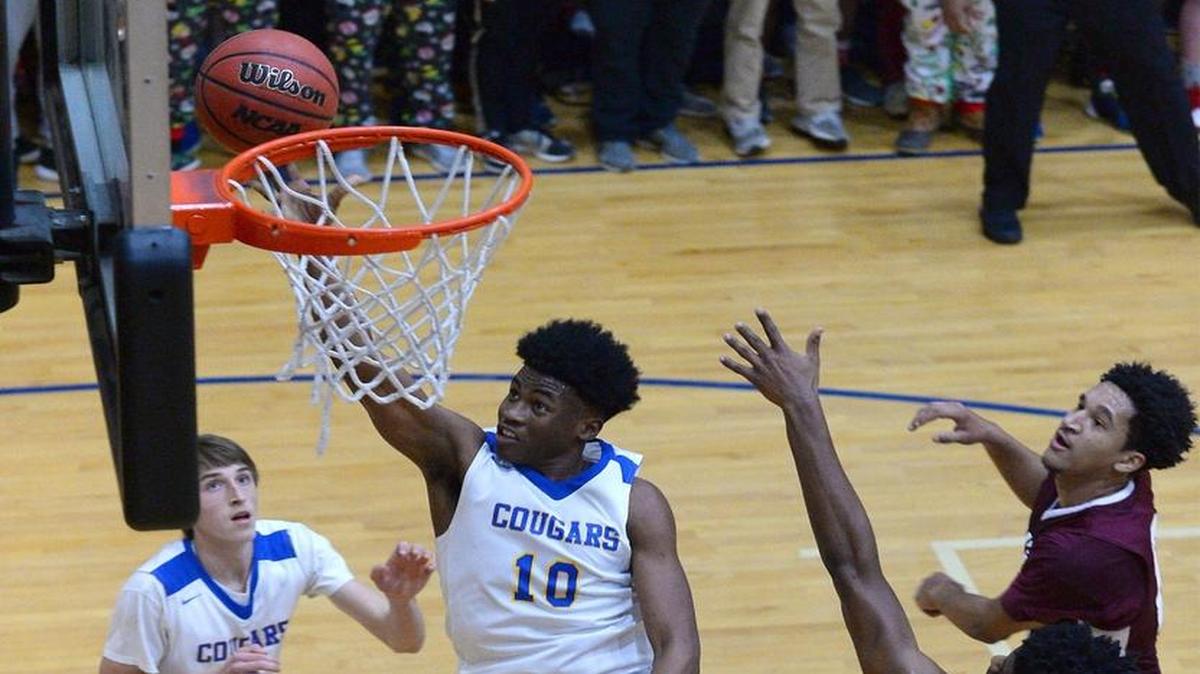 Carmel Christian's Don Gregory, center, and his team whipped United Faith in the SPAA tournament championship game Saturday
