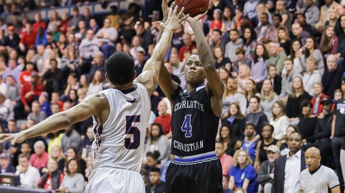 Charlotte Christian's Paul Hudson (4) knocks down a 3-pointer. Providence Day advanced to the NCISAA 3A semifinals by defeating Charlotte Christian on Friday.