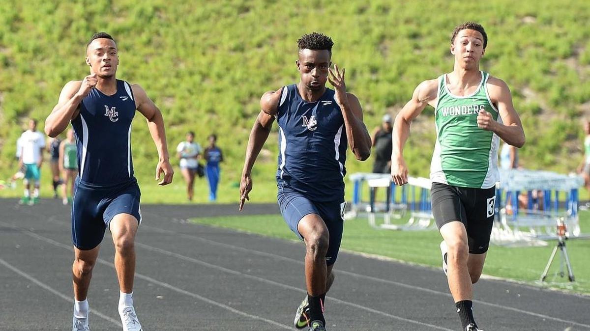 Mallard Creek’s Cravont Charleston (center) is 2016 Charlotte Observer boys track athlete of the year