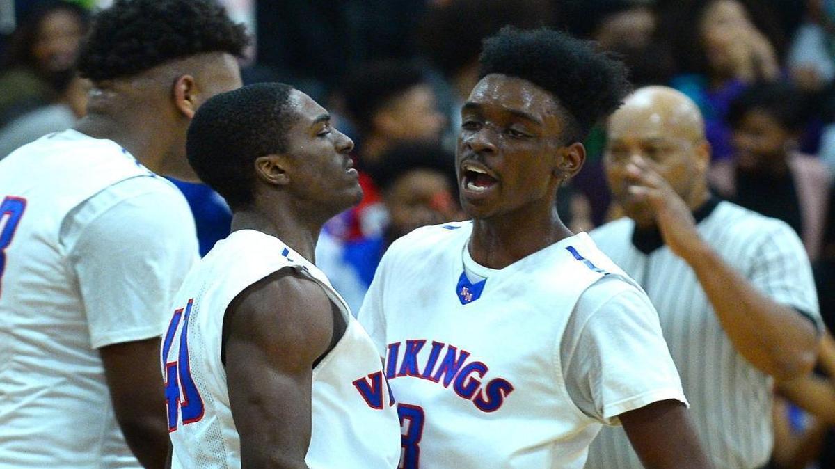 North Meck's Jabril Griffin, left, is congratulated by teammate Vaud Worthy, right, after Griffin's drive to the basket for two-points against Vance on Friday, February 3, 2017 at North Meck High. North Meck defeated Vance 87-77.