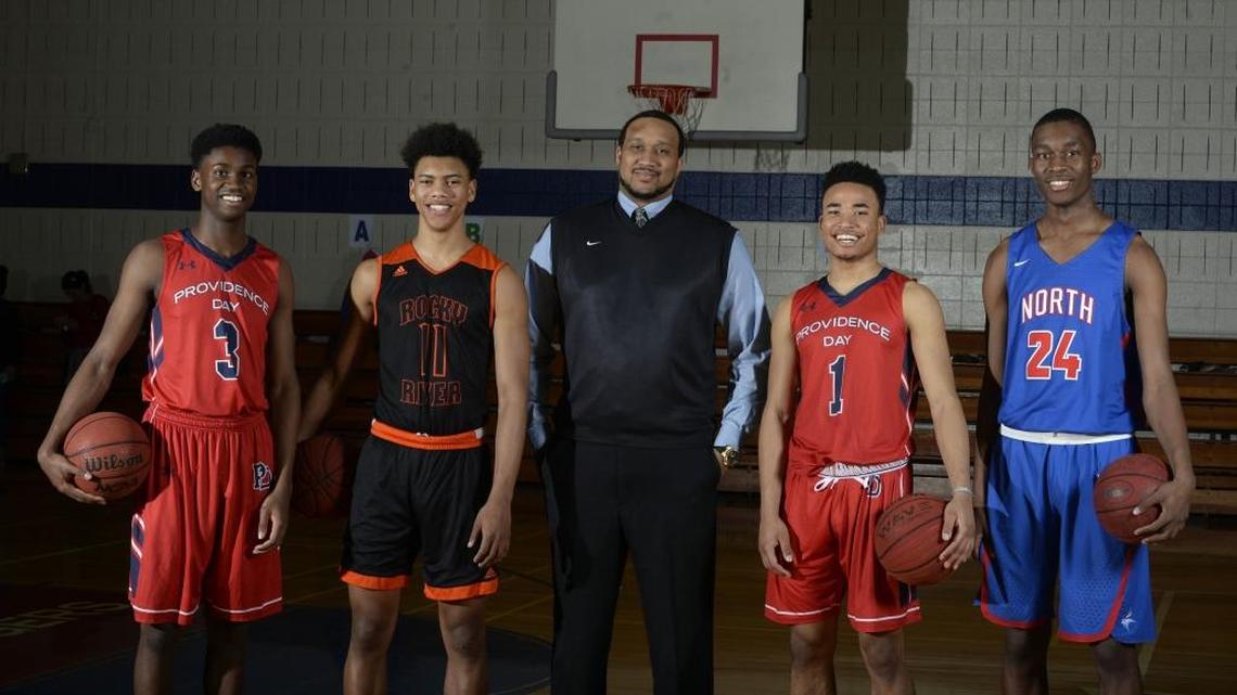 The All-Mecklenburg boys’ basketball team (left to right): Trey Wertz, Providence Day; Jaden Springer, Rocky River; Coach Preston Davis, Independence; Devon Dotson, Providence Day; and Jae'Lyn Withers, North Mecklenburg. Not pictured is Independence’s Jamarius Burton.