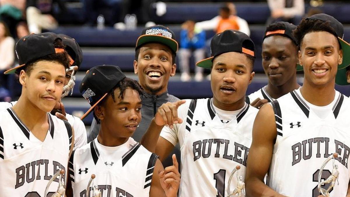 Butler players celebrate their win against Lincoln Charter in Friday night’s Hoodie’s House national tournament game at Providence Day.