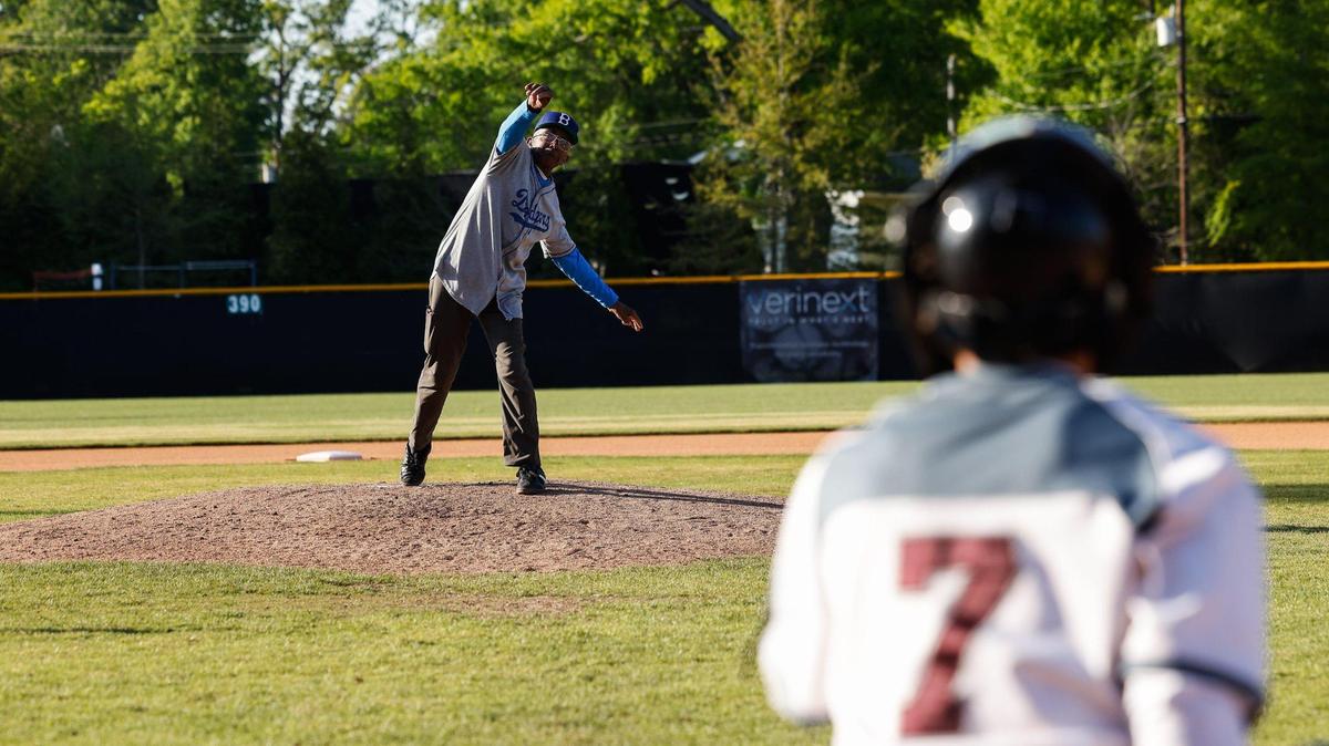 South Carolina native and Negro League legend, Wali Cathcart, throws out the first pitch before the championship game between Phillip O. Berry Academy of Technology and West Mecklenburg High School at Richard “Stick” Williams” Dream Fields and Education Center in west Charlotte on Tuesday, April 15, 2025. Cathcart played for the Newark Eagles, The Joe Black All-Stars and The New York Cuban Giants.