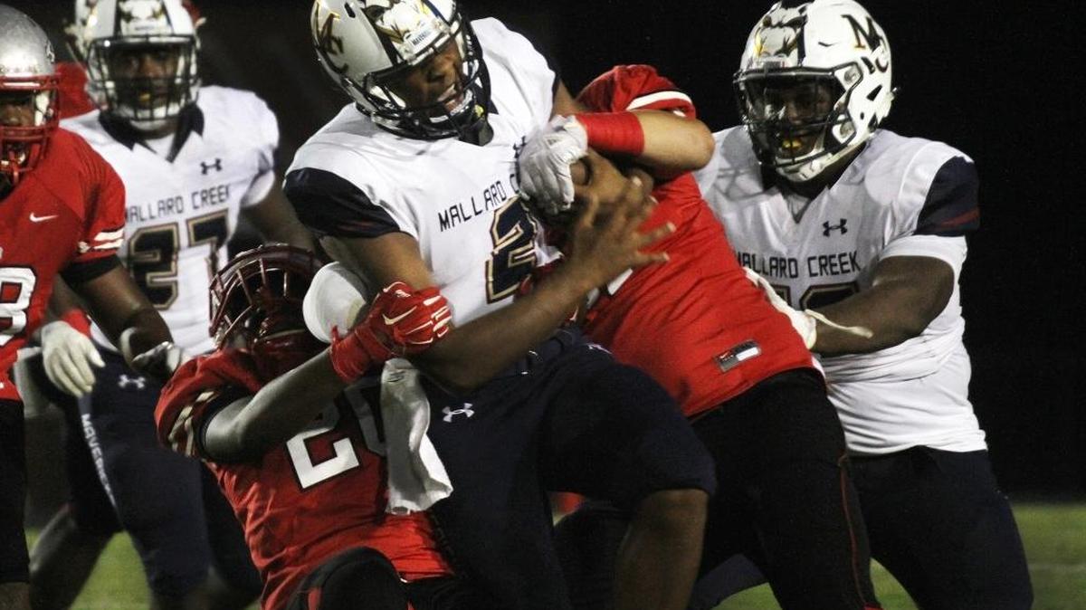 South Pointe defense brings down Mallard Creek's Chauncey Caldwell in Friday’s 17-6 upset win