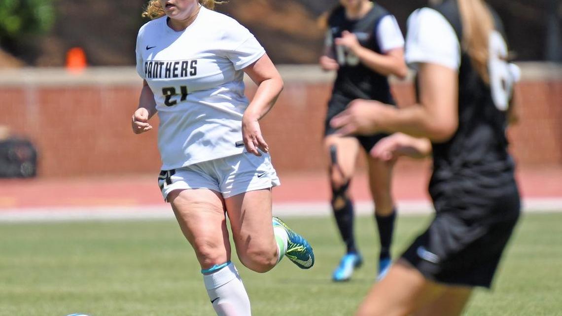Providence junior midfielder Molly McGarry, left, who scored the Panthers’ first goal Saturday, was named MVP of the N.C. 4A girls’ soccer championship in Raleigh. Providence beat Apex Middle Creek 2-1 for its first state title since 1997.