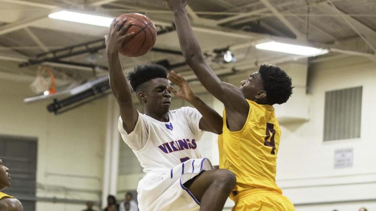 North Meck’s Vaud Worthy drives the lane and scores 2 points in early first half action as the Viking’s hosted the Lions from West Charlotte