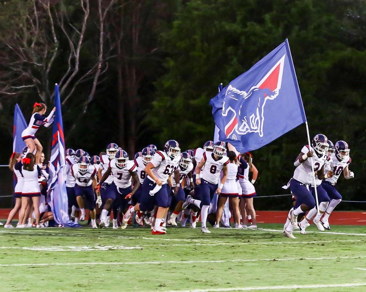 Providence Day runs onto the field before Friday’s 42-6 win at Charlotte Country Day.