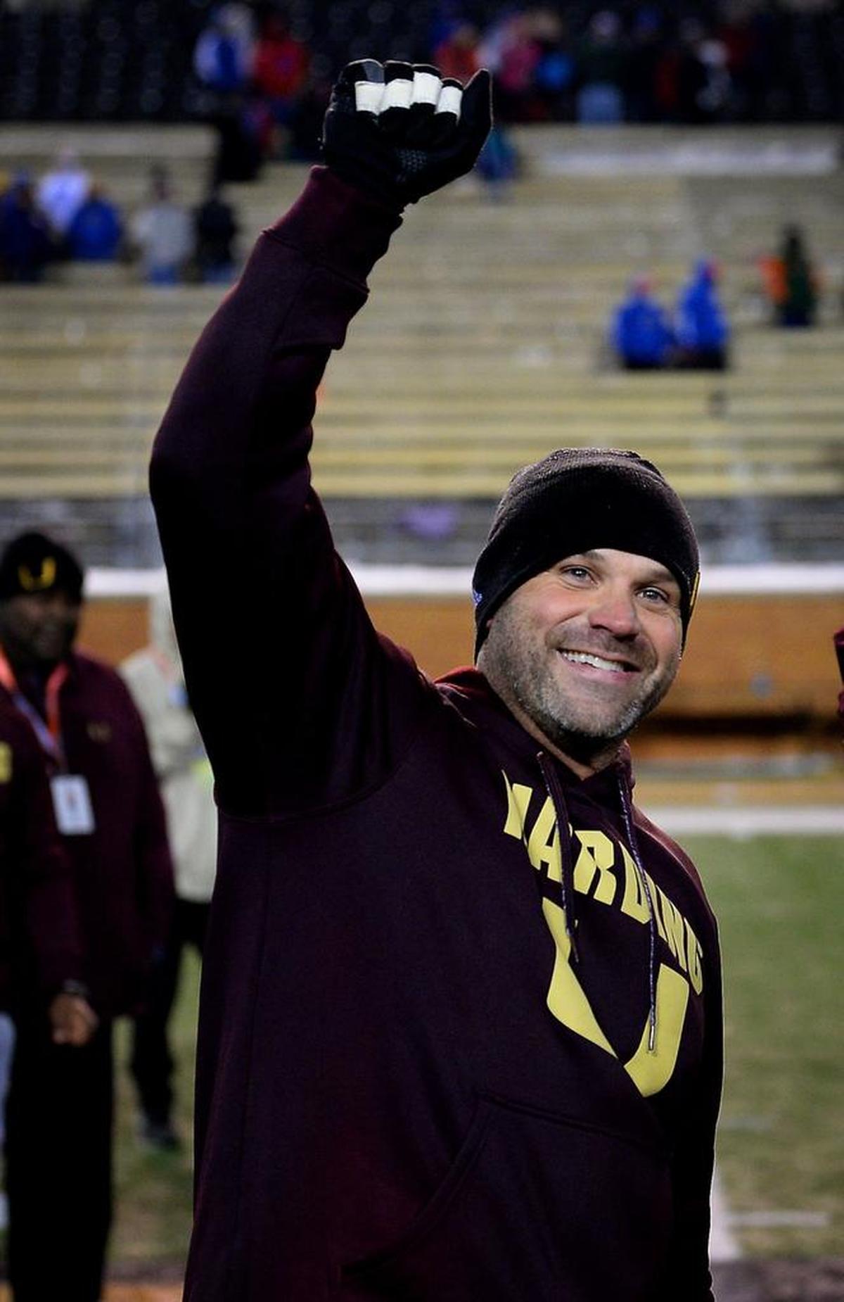 Harding University head coach Sam Greiner smiles at the Harding University fans as he and the team celebrated their victory over Scotland County in the NCHSAA 4A State Championship game at BB&T Field in Winston-Salem, NC on Saturday, December 9, 2017. Harding defeated Scotland County 30-22.