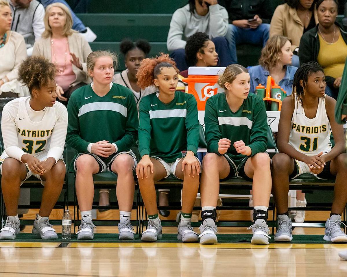 Independence High’s girls await the start of Tuesday’s game against Olympic