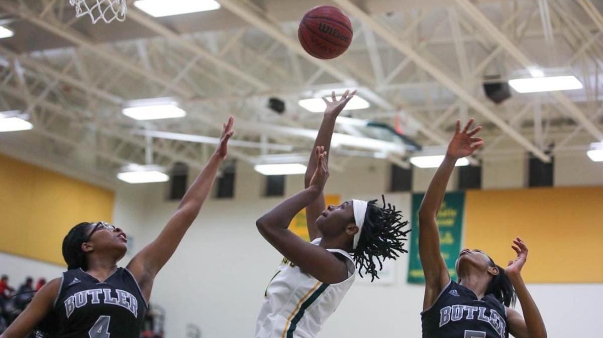Independence player Ayanna Anderson (center) drives the baseline and shoots a running two point shot during early 1st half action. Independence would host Butler Friday night December 14, 2017.