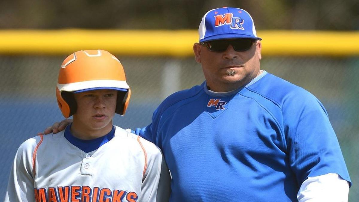 Marvin Ridge coach Mark Mennitt, right, and his team are l looking to repeat as state 3A baseball champions this weekend.