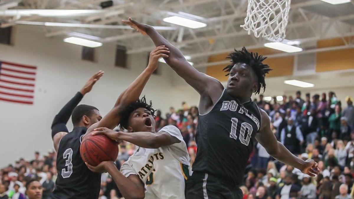 A.J McKee drives the lane against G. Gates (10) and D.J. Little (3) and attempts a two point bucket. A.J would be fouled on the play and knock down both free throws. Independence would host Butler Friday night December 14, 2017.