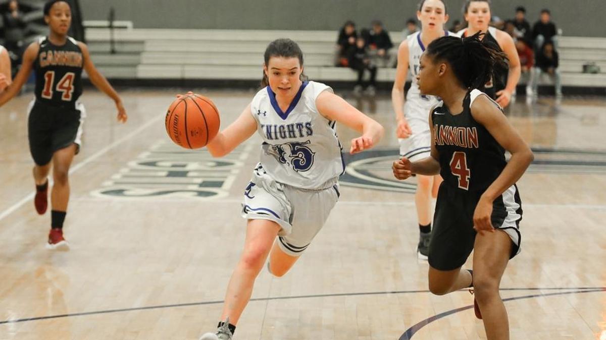 Sophomore Lindsay Noonan (15) of Charlotte Christian drives the lane and finishes the layup. The Knights beat Concord Cannon School Tuesday.