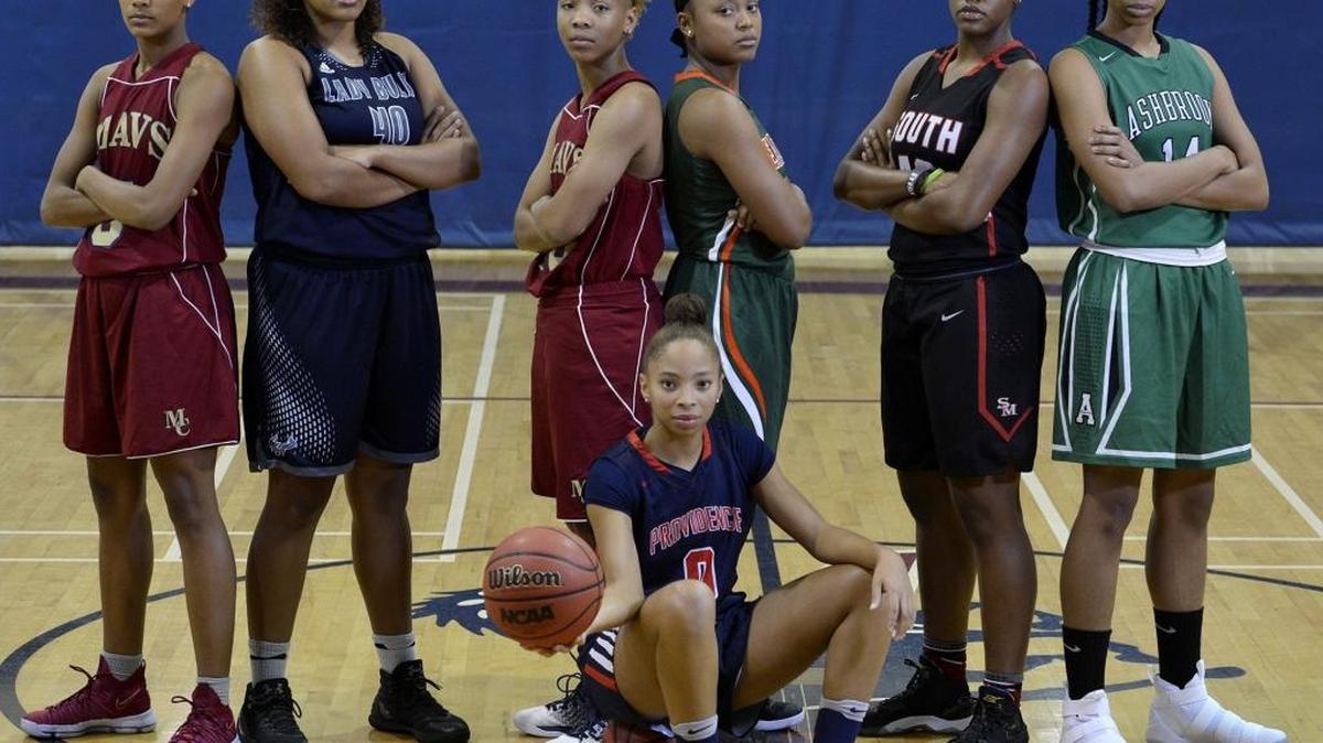 Seven of the area's top high school basketball stars, from left to right: Mallard Creek's Ahlana Smith, Hickory Ridge's Gabby Smith, Mallard Creek's Dazia Lawrence, East Lincoln's Destiny Johnson, South Meck's A'Lea Gilbert, Ashbrook's Evonna McGill and Providence Day's Kennedy Boyd (seated).