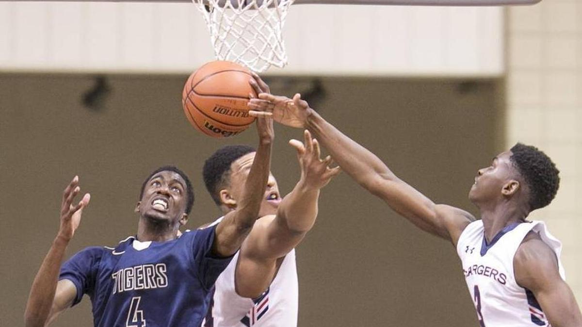 Douglas County (GA) star Brandon Robinson, a UNC basketball recruit, fights for a rebound against Providence Day Monday. The teams met at the Hoodies House tournament