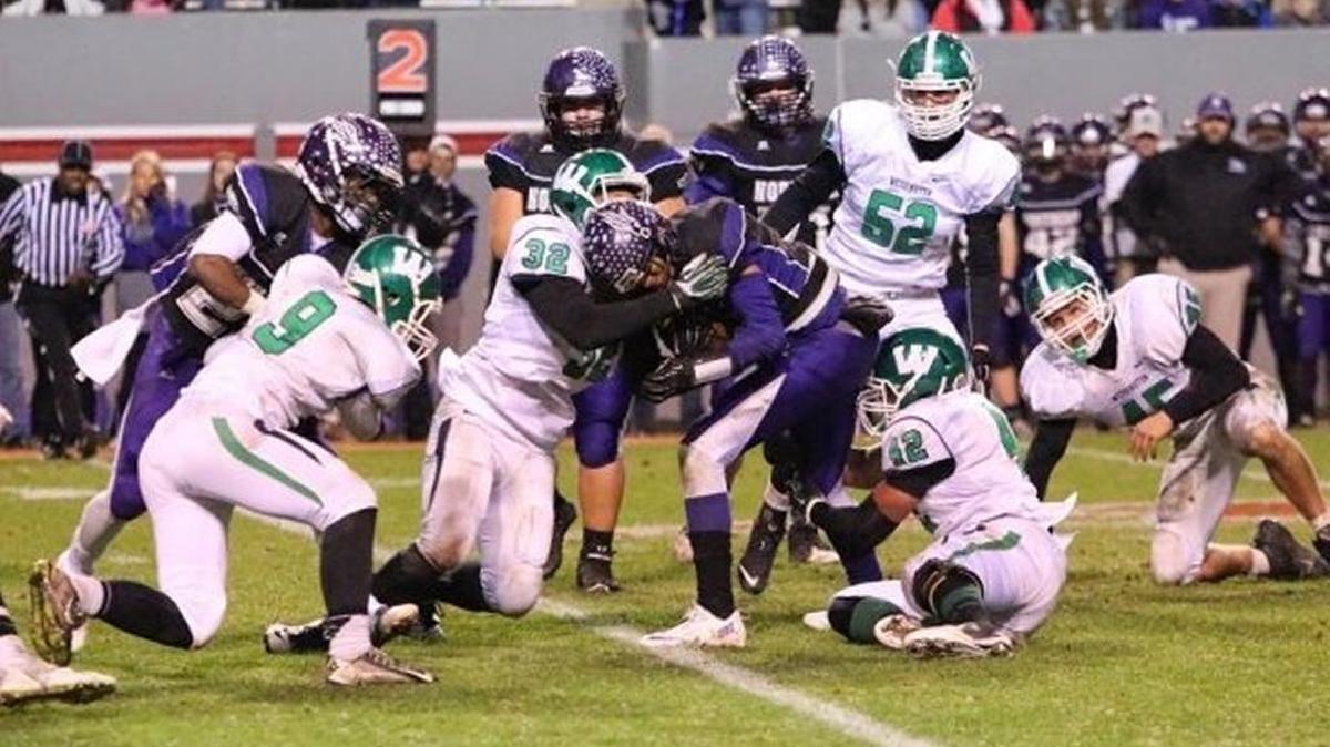 Weddington linebacker Lance Moore (32) seen here making a tackle in the 2014 N.C. 3AA state championship game leads the Observer area in sacks in 2015