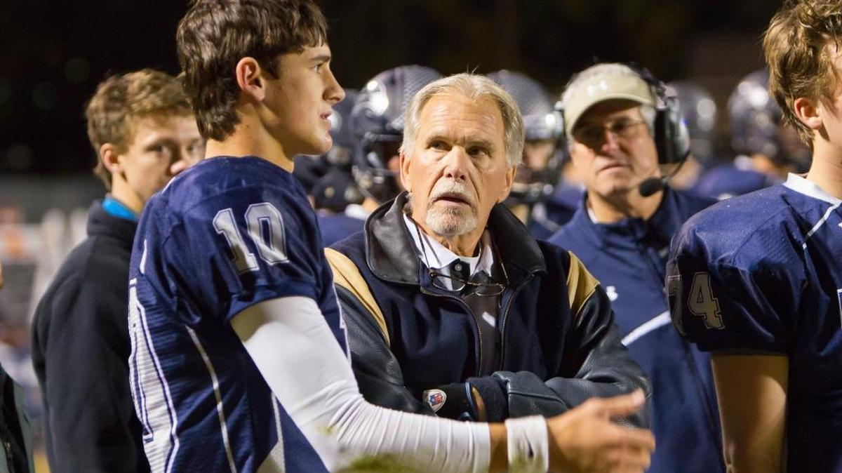 Longtime Charlotte Latin football coach Larry McNulty, shown in 2014 with all-state quarterback Daniel Jones, will retire after the Hawks’ NCISAA 2A championship game Friday night against Charlotte Country Day.