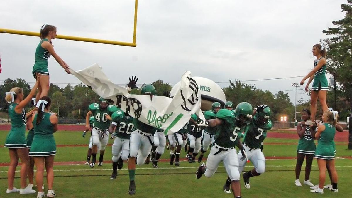 Myers Park players take the field to the cheers of the crowd in 2008 before playing Garinger. A national expert thinks that high school football is dangerous and needs some rules revisions, advocates eliminating tackle football for younger kids. DIEDRA LAIRD - dlaird@charlotteobserver.com