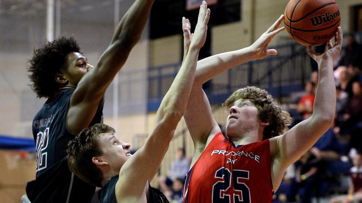Providence Day's John Mirala, right, fights to get a shot off over Seffner Christian Academy defenders Derek Webster, left and Christian Noskey, center, during first half action on Wednesday, December 28, 2016 at Providence Day School. Both teams are playing in the Hoodies House Tournament.