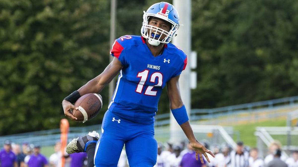 North Mecklenburg quarterback Aaron Scott celebrates as he scores on a 71-yard run in the Vikings’ 43-24 victory against Cox Mill on Wednesday night. The Vikings play Mooresville Friday in an Observer game of the week.