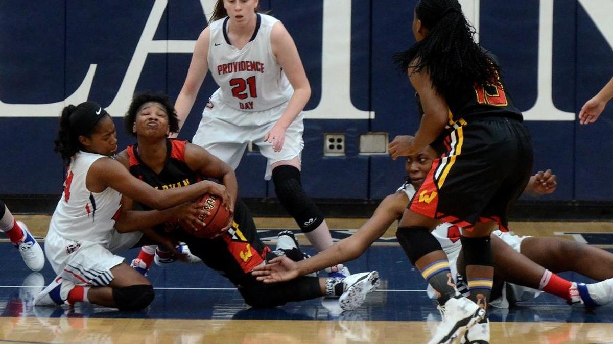Providence Day's #24 MilLeia Owens, left, Wesleyan Christian's #5 Shaniya Jones, center, and Providence Day's Janelle Bailey, right, tangle during Saturday's NCISAA 3A girls state championship game at Charlotte Country Day School.
