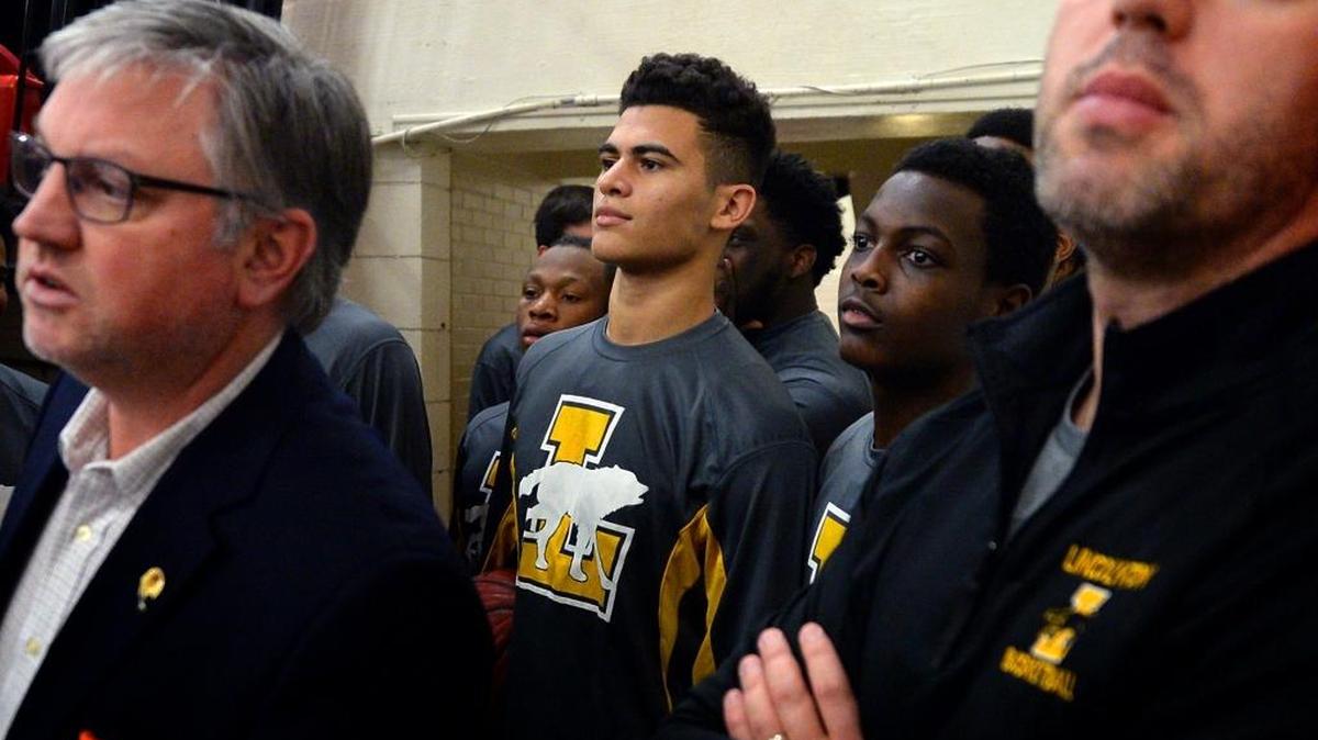Sage Surratt, center, was named NC Associated Press state boys basketball player of the year Friday.