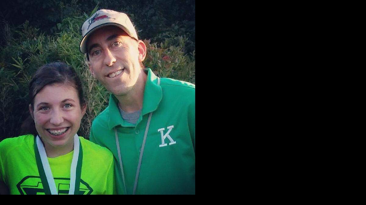 
A.L. Brown runner Briana Landis, left, with father and track coach Brian, has multiple sclerosis. She says running has been therapeutic for her because it has helped reduce the size of the lesions on her brain.
