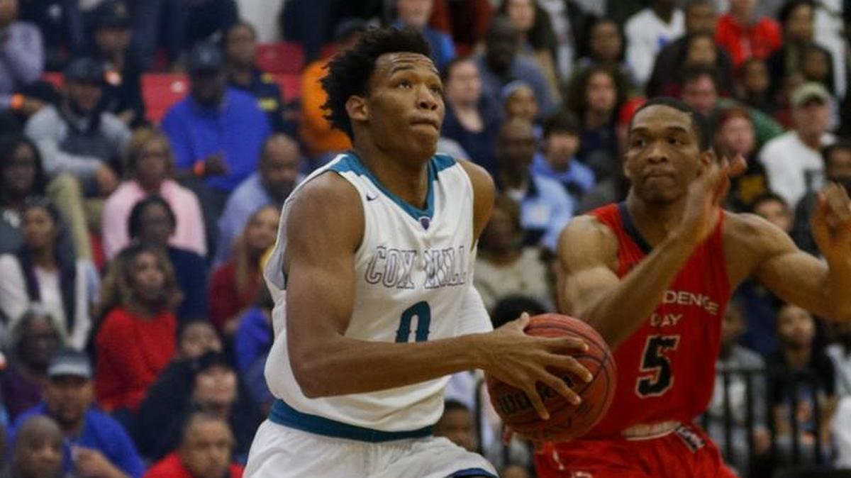 Cox Mill guard Wendell Moore Jr. drives to the basket past Providence Day basketball player Isaac Suffren in the Charlotte Hoops Challenge at Berry High in Charlotte, N.C., Saturday, Nov. 25, 2017. (Nell Redmond photo)