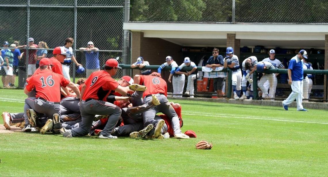 Wesleyan Christian Academy baseball players celebrate winning over Charlotte Christian in the NCISAA 3A state championship baseball game at Charlotte Country Day Saturday afternoon.