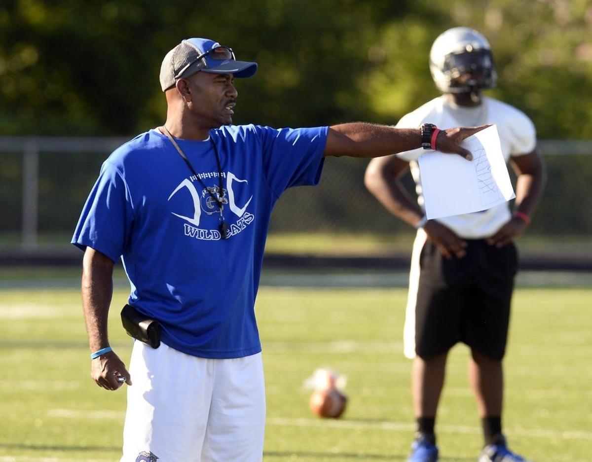 First-year Garinger football coach Jeff Caldwell directs the Wildcats during the team’s season-opening practice on Monday. Caldwell inherited a program that hasn’t won a game in the past six seasons.
