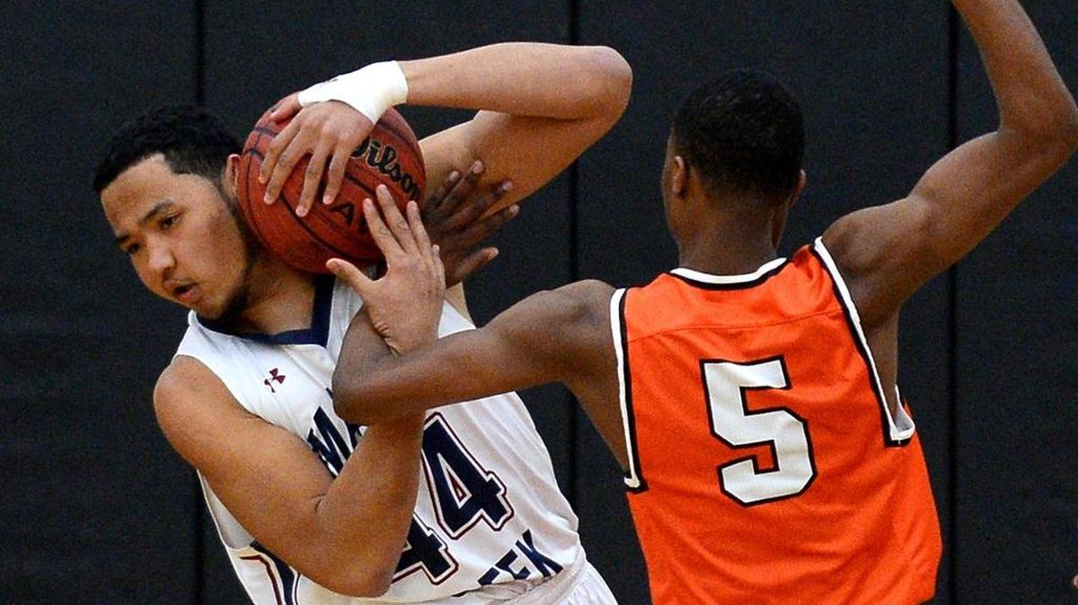 Mallard Creek's Juwuan Tate, left, fights to maintain control of a rebound as Vance's Tysheem Raboulin, right, applies pressure during first half action at Hough High School on Wednesday, February 15, 2017. The two teams were competing in the MECKA semifinals.