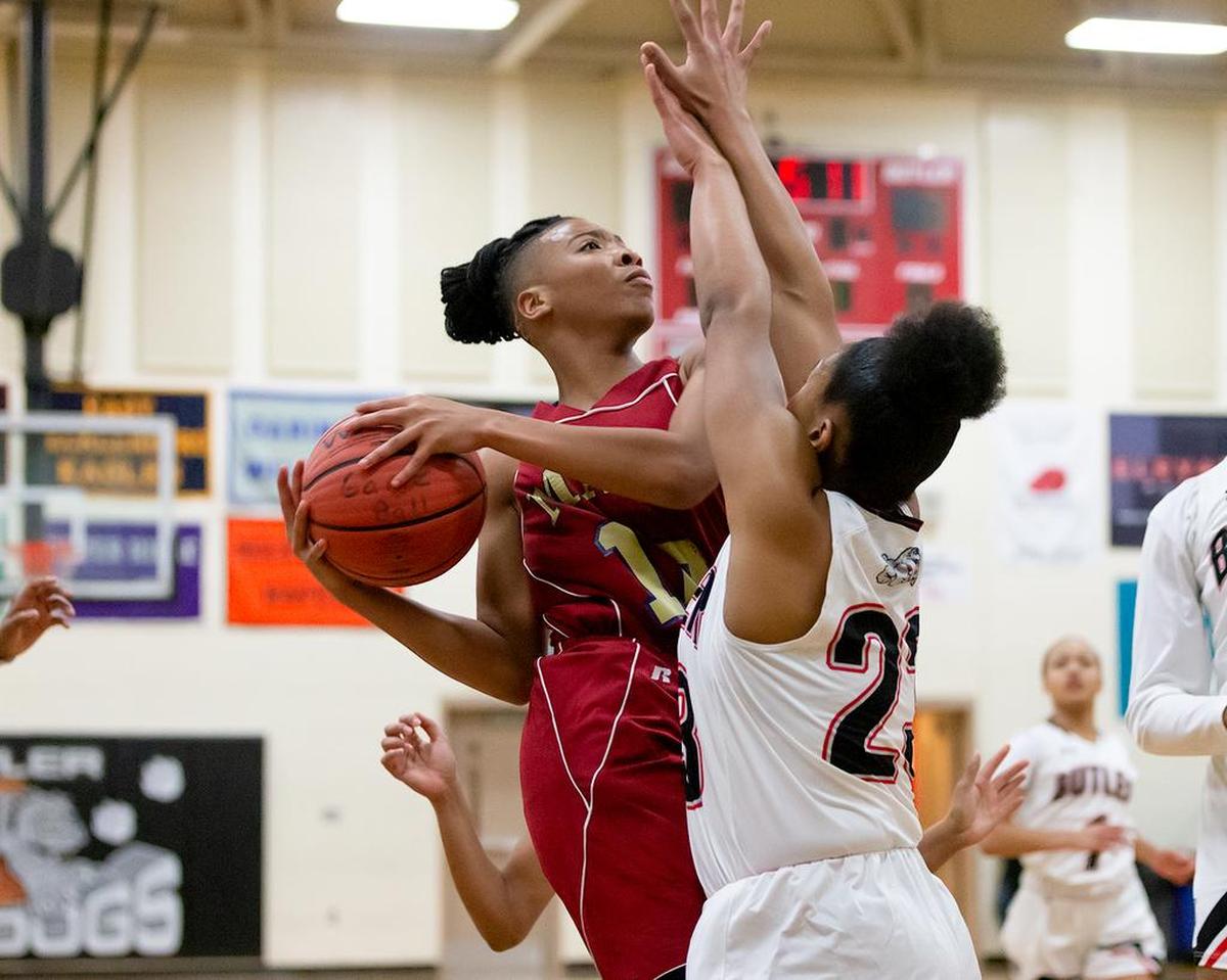 Mallard Creek’s Dazia Lawrence (10) drives the lane and is fouled during early 2nd quarter action.