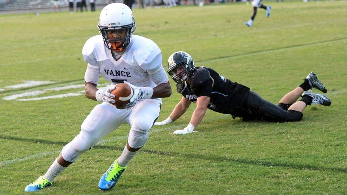 
Vance’s Jonathan Ifedi (7) catches a pass and runs for Vance's second touchdown past Providence defender Dru Seabrook during the Vance at Providence football game on Friday5. 
