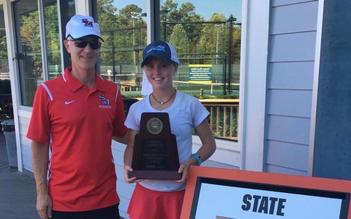 South Meck freshman tennis star Jenna Thompson, pictured with coach Roy Hudson, won the N.C. High School Athletic Association 4A state title Saturday